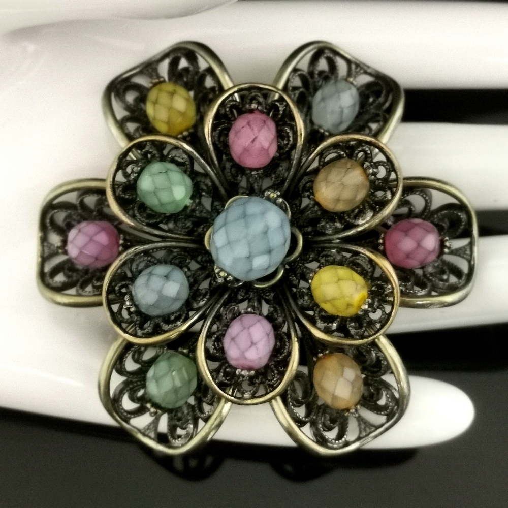Joan Rivers Brooch Pin with faceted stones and metal scrolls - Muiti-colored